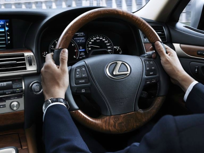 hand with lexus wheel 